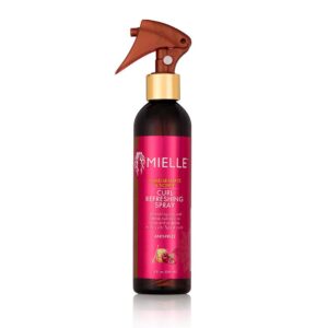 Un spray a base de agua realzado con aceites esenciales para brillar y redefinir el cabello grueso y rizado.